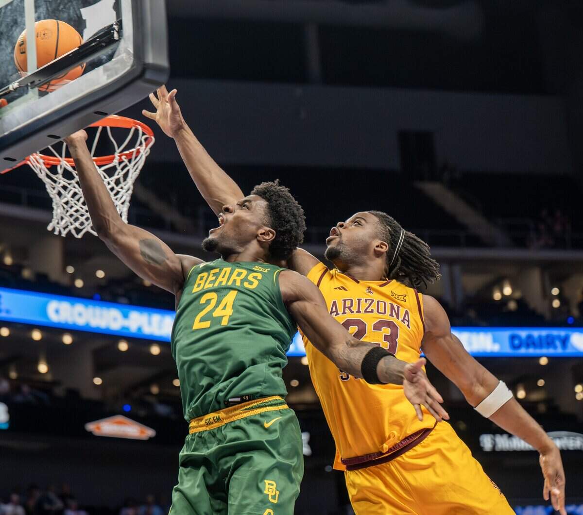 Baylor Bears guard Tounde Yessoufou (24) makes a lay up as Arizona State Sun Devils forward Allen Mukeba (23) attempts to block the shot during the first half of the Big 12 Men's Basketball Tournament at T-Mobile Center on Tuesday, March 10, 2026, in Kansas City.