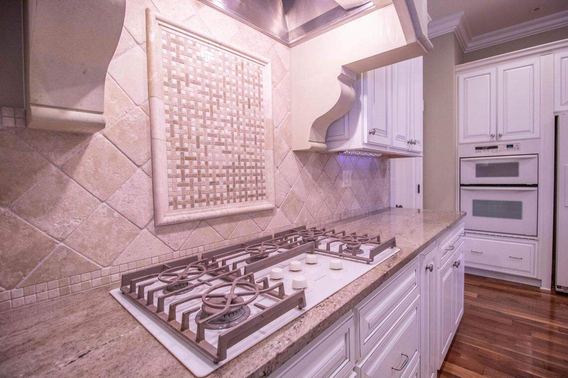 The kitchen has been renovated in this home for sale in Fayette, Missouri. Through a metal door and down some stairs: a nine-cell jail.