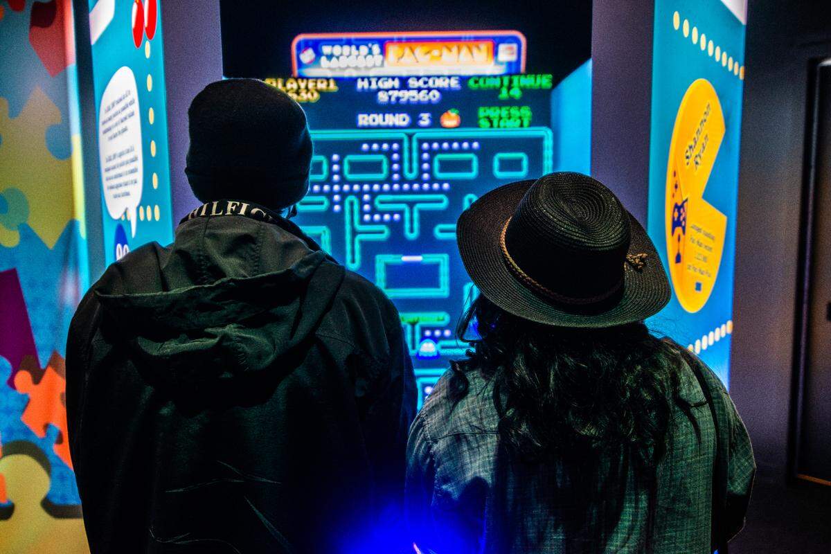 Guests visiting The Science of Guinness World Records at Union Station in Kansas City can try their hands at Pac-Man, the 80s arcade video game.