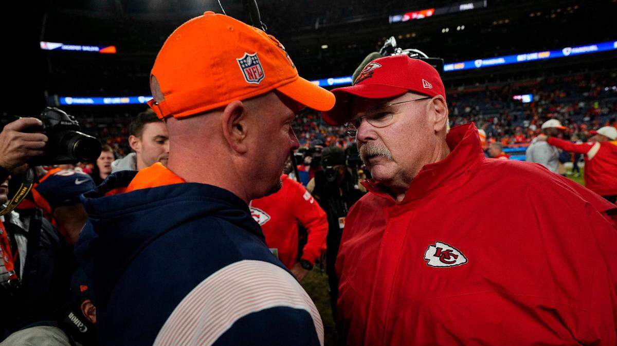 Denver Broncos head coach Nathaniel Hackett talks with Kansas City Chiefs head coach Andy Reid after a game on Sunday, Dec. 11, 2022. Hackett will not be coaching the Broncos come Sunday’s rematch.