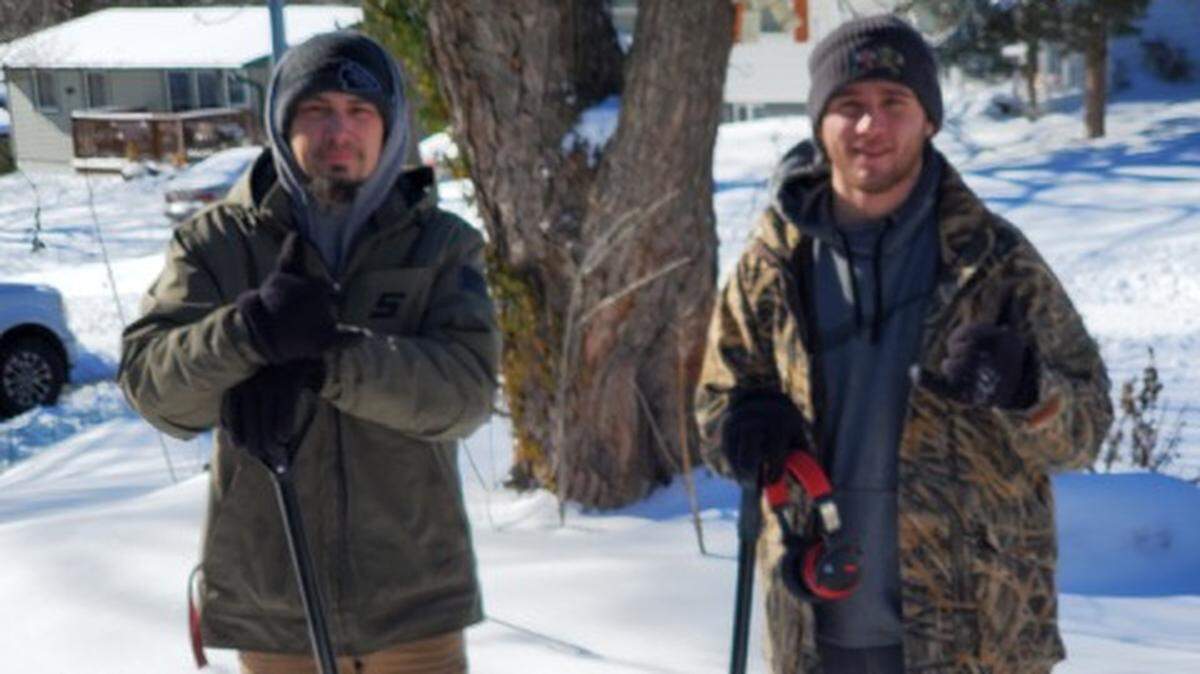 Robert Young and his brother, Blake Thompson, of Good Vibes Handyman Services, arrive at home of Ginger Cone in Gladstone, Mo., on Monday to dig out her cars and driveway so she could make a hospital appointment.