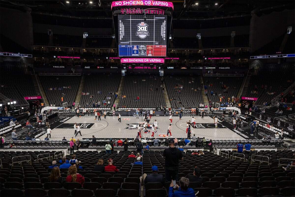 After complaints surfaced about the new glass LED floor at this year’s Big 12 men’s and women’s basketball tournaments, a traditional wood court was installed overnight before the Iowa State-Arizona men’s semifinal game at T-Mobile Center in Kansas City on Friday, March 13, 2026.