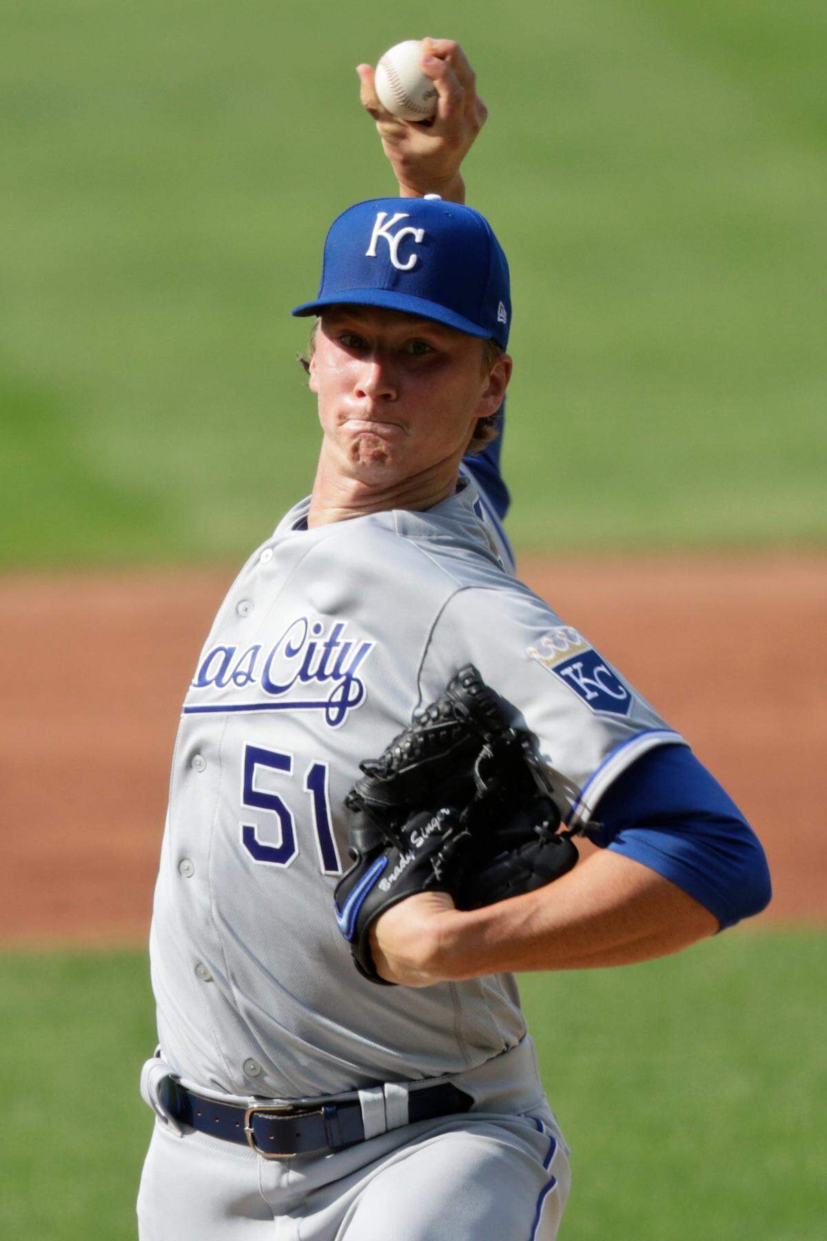 Kansas City Royals starting pitcher Brady Singer delivers in the first inning in a baseball game against the Cleveland Indians, Saturday, July 25, 2020, in Cleveland. (AP Photo/Tony Dejak)