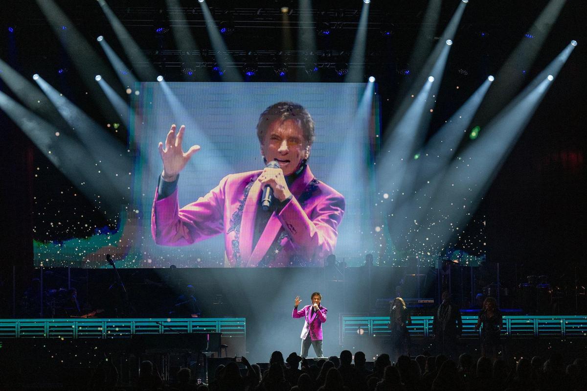 Barry Manilow performs on stage at the T-Mobile Center during a stop in Kansas City as part of The Last Concerts Tour on Sunday.