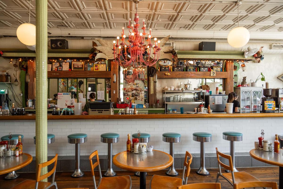 Artistic decor creates a unique space inside Succotash in Kansas City. The breakfast and brunch restaurant is owned by Beth Barden and has been in business for over 20 years. Barden sees the decor as an extension of herself, a majority of it having been donated or gifted to Barden by close friends.