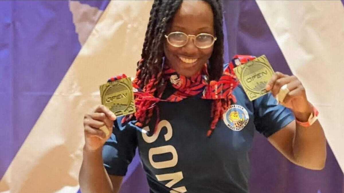 Ray’Von Haney holds two medals at a professional Jiu-jitsu competition in 2022.