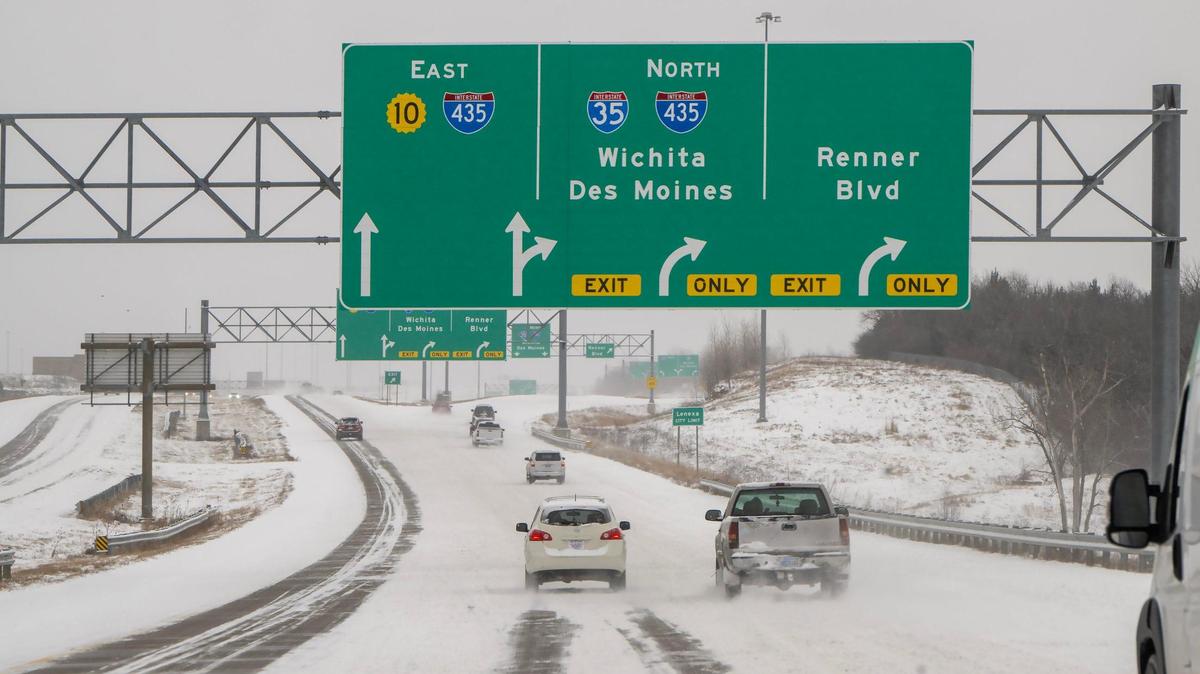 Traffic slowed as a layer of snow blanketed Kansas 10 near the Interstate 435 in Lenexa after a winter storm dropped several inches across the Kansas City region on Wednesday, Feb. 12, 2025.