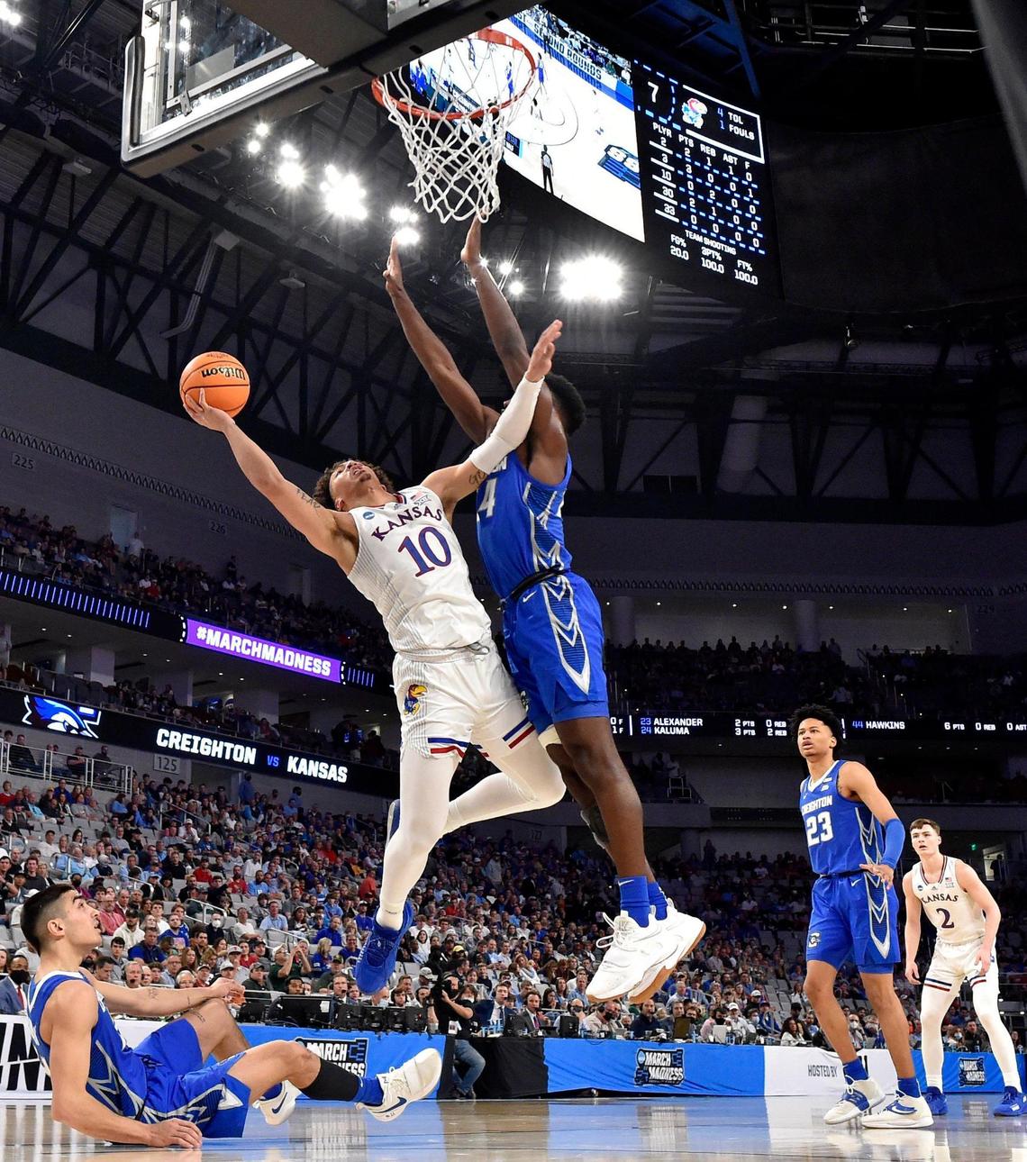 KU’s Jalen Wilson drives on Creighton’s Arthur Kaluma during the first half of Saturday’s NCAA Tournament game in Fort Worth.