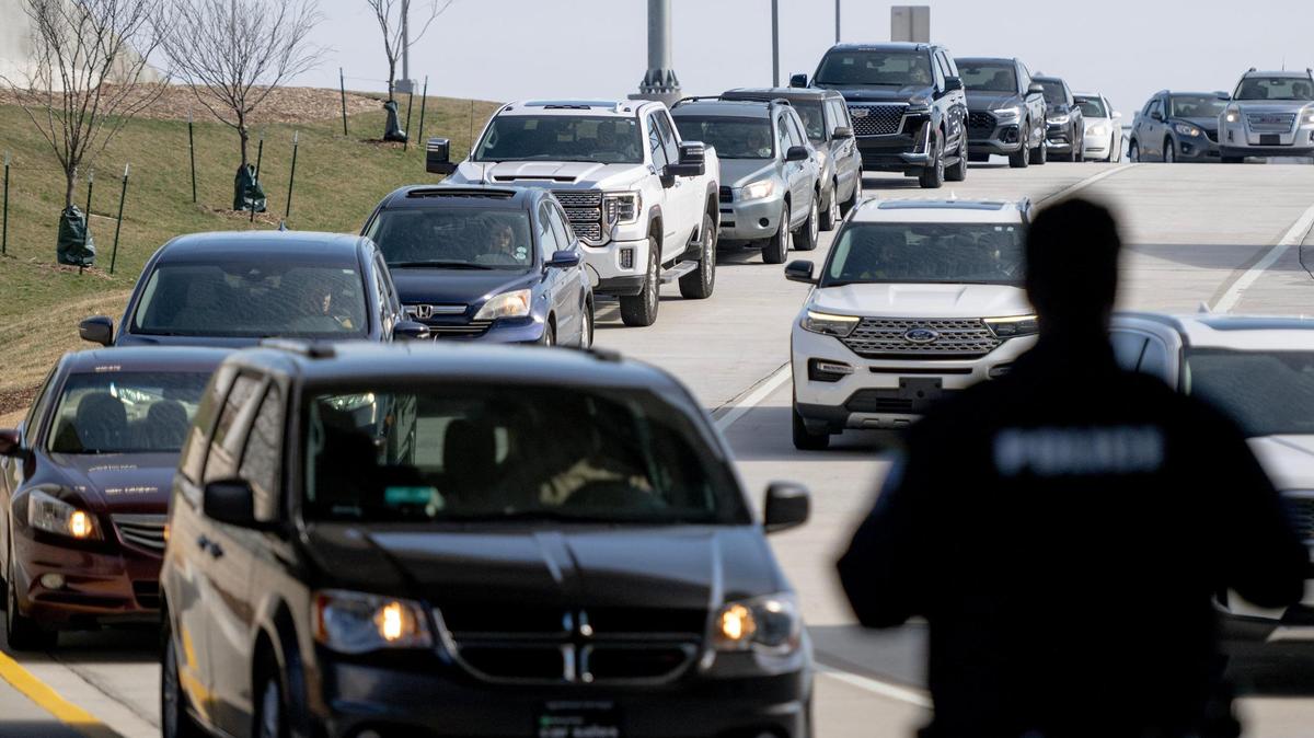 Traffic begins to backup Sunday before reaching the arrivals level pickup area at the new single terminal at Kansas City International Airport.