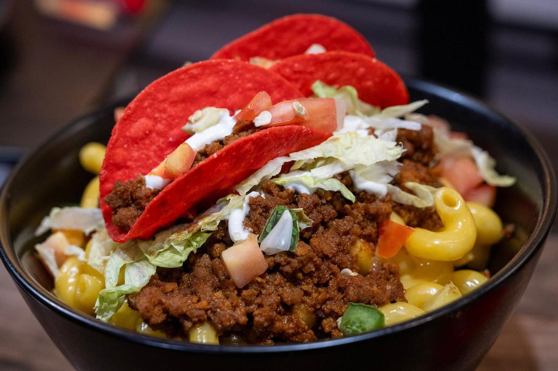 Taco Mac & Cheese is a new offering from Aramark for the general concessions at GEHA Arrowhead Stadium. The item features mac and cheese seasoned with taco meat, sour cream, lettuce, pico de gallo and topped with mini red tacos.