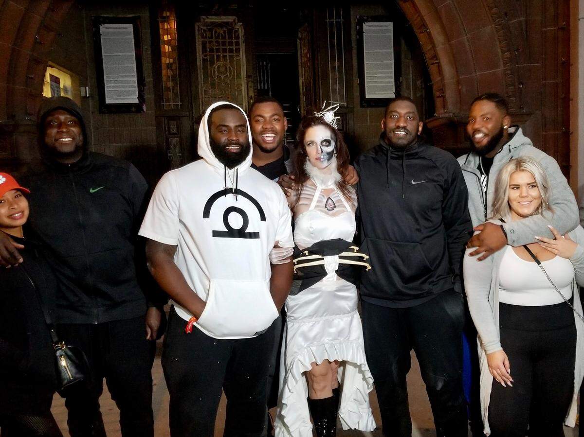Amber Arnett-Bequeaith, middle in costume, with the Chiefs players who brought their families to The Beast in 2017.