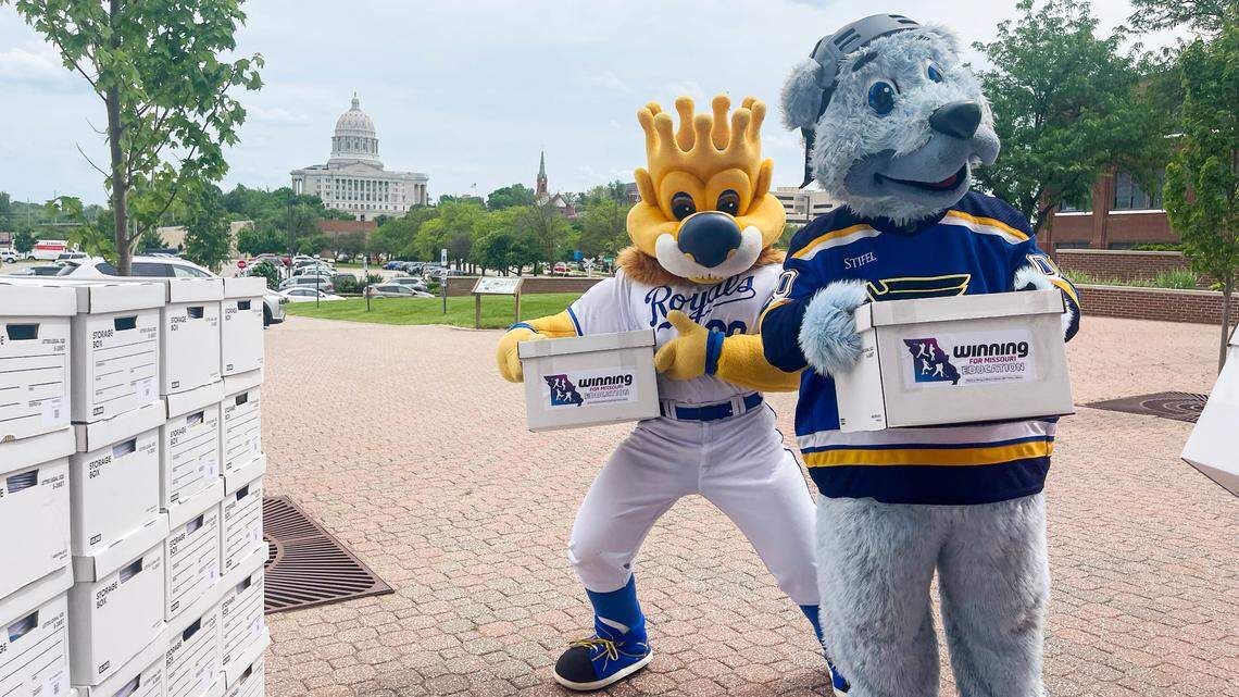 Kansas City Royals mascot Sluggerrr, left, and St. Louis Blues mascot Louie delivered signatures in Jefferson City to place legalized sports betting on the ballot.