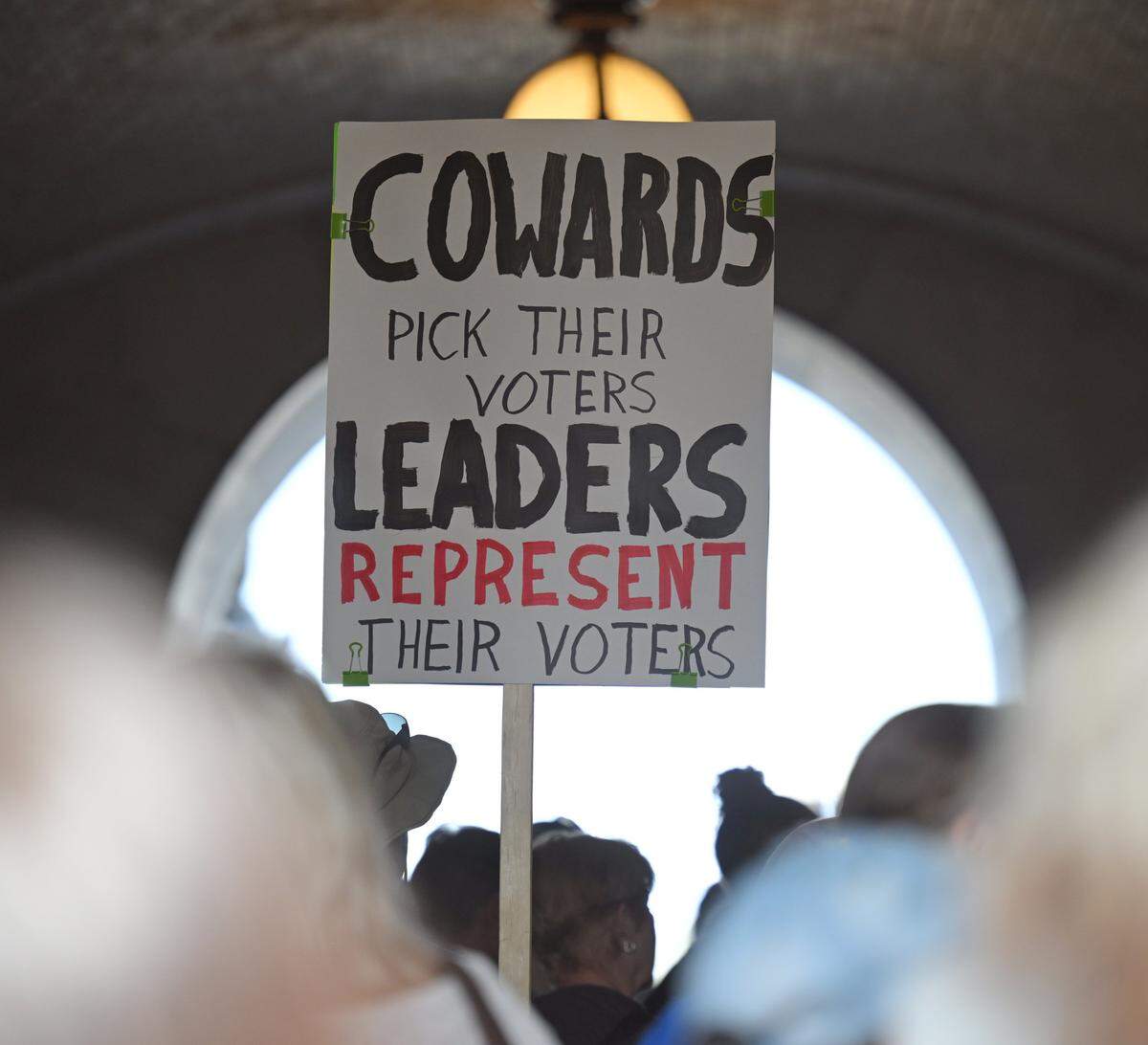 People gather at the Missouri statehouse in Jefferson City on Wednesday, Sept. 10, 2025, to protest the legislature's efforts to change the state's congressional district maps. The proposed change would divide Kansas City into districts that would include vast rural areas of the state.