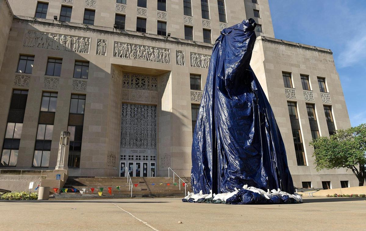 After being vandalized Thursday, the statue of Andrew Jackson in front of downtown’s Jackson County Courthouse was covered with a tarp on Friday.
