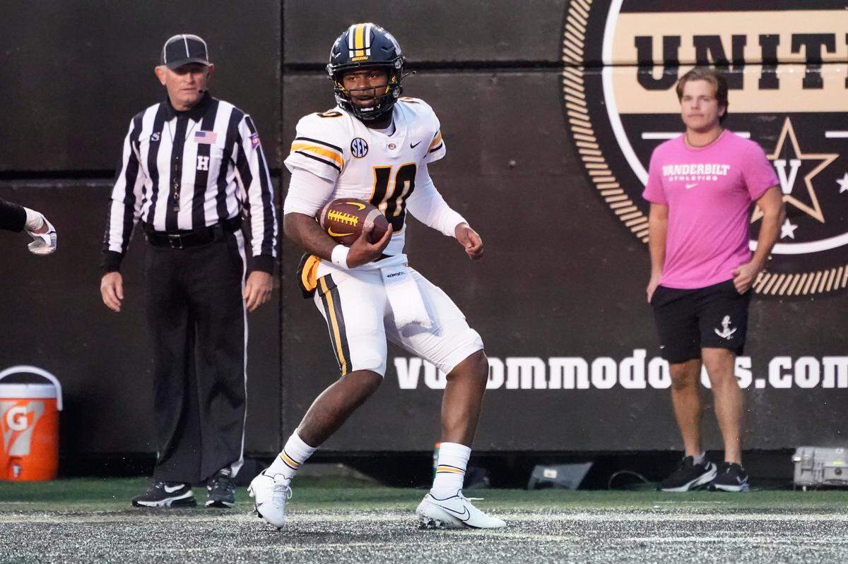 Missouri quarterback Tyler Macon (10) scores a touchdown against Vanderbilt in the second half of an NCAA college football game Saturday, Oct. 30, 2021, in Nashville, Tenn. (AP Photo/Mark Humphrey)