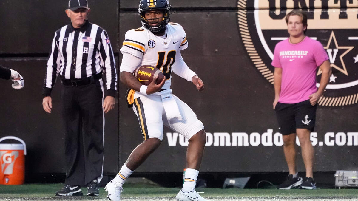 Missouri quarterback Tyler Macon (10) scores a touchdown against Vanderbilt in the second half of an NCAA college football game Saturday, Oct. 30, 2021, in Nashville, Tenn. (AP Photo/Mark Humphrey)