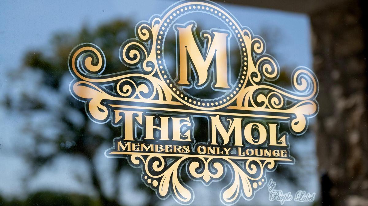There’s no sign above the MOL, only a gold emblem in the window. That adds to the intrigue for passersby.