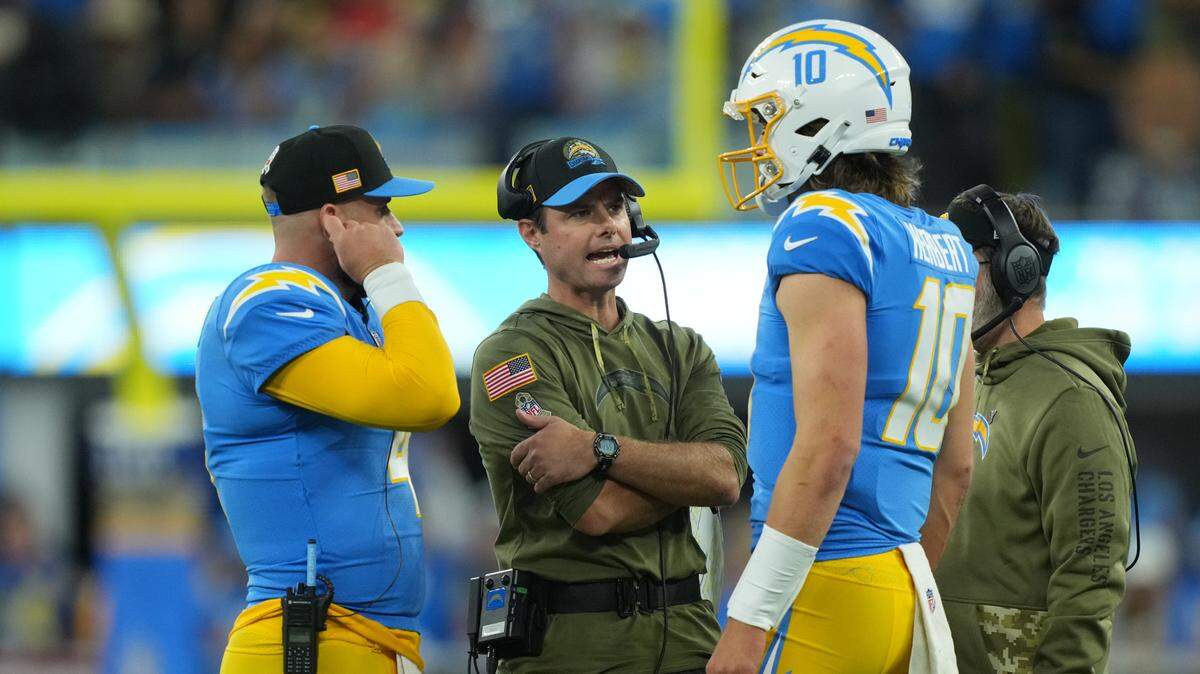 Nov 20, 2022; Inglewood, California, USA; Los Angeles Chargers head coach Brandon Staley (center) talks with quarterback Justin Herbert (10) and quarterback Chase Daniel (4) in the first half against the Kansas City Chiefs at SoFi Stadium. Mandatory Credit: Kirby Lee-USA TODAY Sports