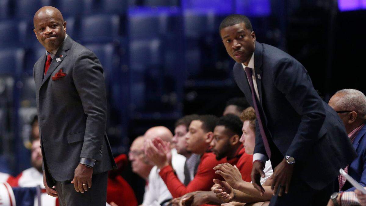 Arkansas head coach Mike Anderson and assistant coach TJ Cleveland watch the team during the first half of the SEC Men’s Basketball Tournament game at Bridgestone Arena in Nashville, Tenn., Thursday, March 14, 2019.