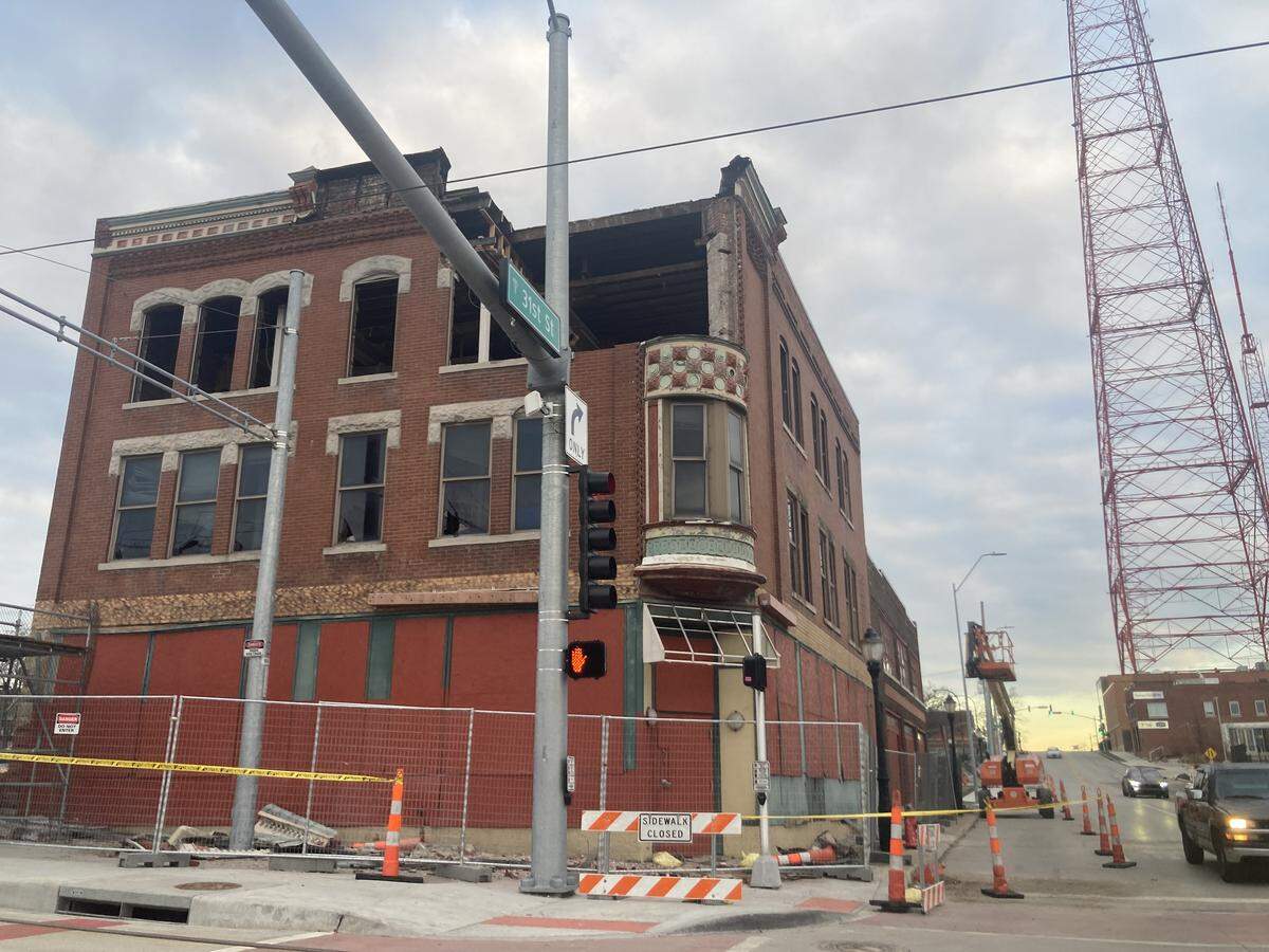 The top of the Queen Ann tower of the Tower Building, also known as the Jeserich building, came down Friday, Jan. 9. The oldest building on Kansas City’s Main Street corridor, it is was deemed unsafe and is being removed to make room for new development.