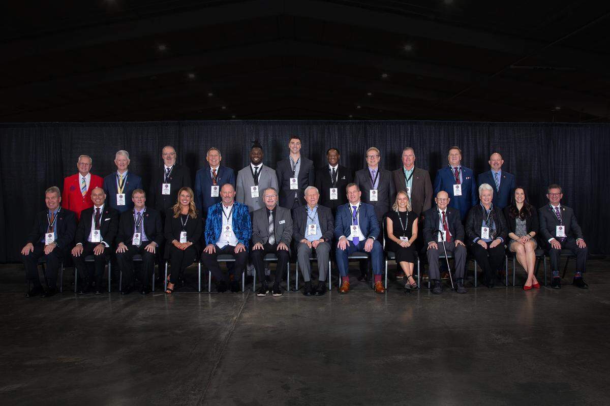 Front row, from left: Jan Stahle, ACE Award recipient Brent Dunn, Mike McClure, Cayla Timberlake (representing the Mizzou Golden Girls), Bret Saberhagen, Chairman Kris Conley, President’s Award recipients Bill & Joe Turner, Emily Scott Githens, Bob Kinloch, Dr. Peggy Martin, Caitlin Peterson (representing UCM Volleyball), and Mike Machholz (representing Missouri Valley College Wrestling 1996-2005). Back row: President Emeritus Jerald Andrews, Don Knapp, Tom Rackers, Greg Garton, Sean Weatherspoon, Tyler Hansbrough, Daryel Garrison, Bill Shelley (representing Blue Springs Swimming Eras of 195-1996 & 2004-2009), Doug Middleton, Mike Spruill of KOLR 10 TV, and CEO & Executive Director Byron Shive.
