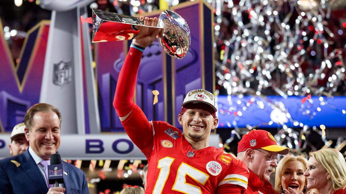 Kansas City Chiefs quarterback Patrick Mahomes (15) hoists the Lombardi Trophy after the Chiefs defeated the San Francisco 49ers in overtime 25-22 in Super Bowl LVIII on Sunday, Feb. 11, 2024, in Las Vegas.