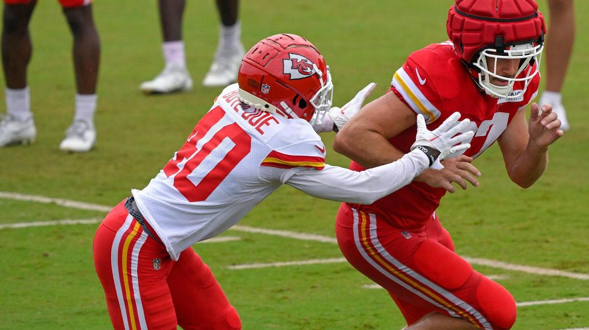 Chiefs cornerback Ekow Boye-Doe (40) goes after tight end Travis Kelce (87) during training camp at Missouri Western State University on Friday, Aug. 4, 2023, in St. Joseph, Missouri.