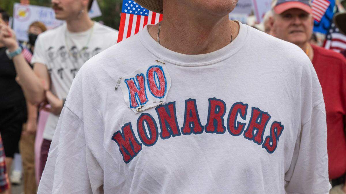 Demonstrators rally on Saturday, October 18, 2025, at Mill Creek Park in Kansas City as part of nationwide “No Kings” protests against the Trump administration. Protesters dressed up in costumes and brought signs showing their displeasure.