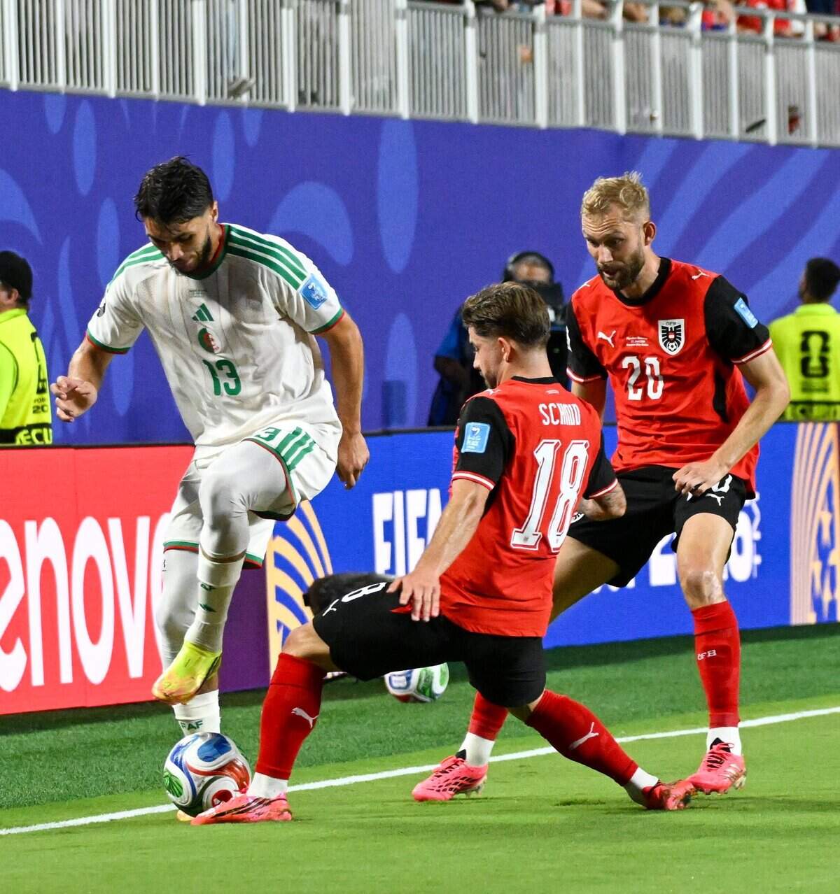 Algeria defender Jaouen Hadjam (13) tries to save a ball from Austria midfielder Romano Schmid (18) during the first half of the World Cup game between Algeria and Austria at Kansas City (Arrowhead) Stadium on Saturday, June 27, 2026.