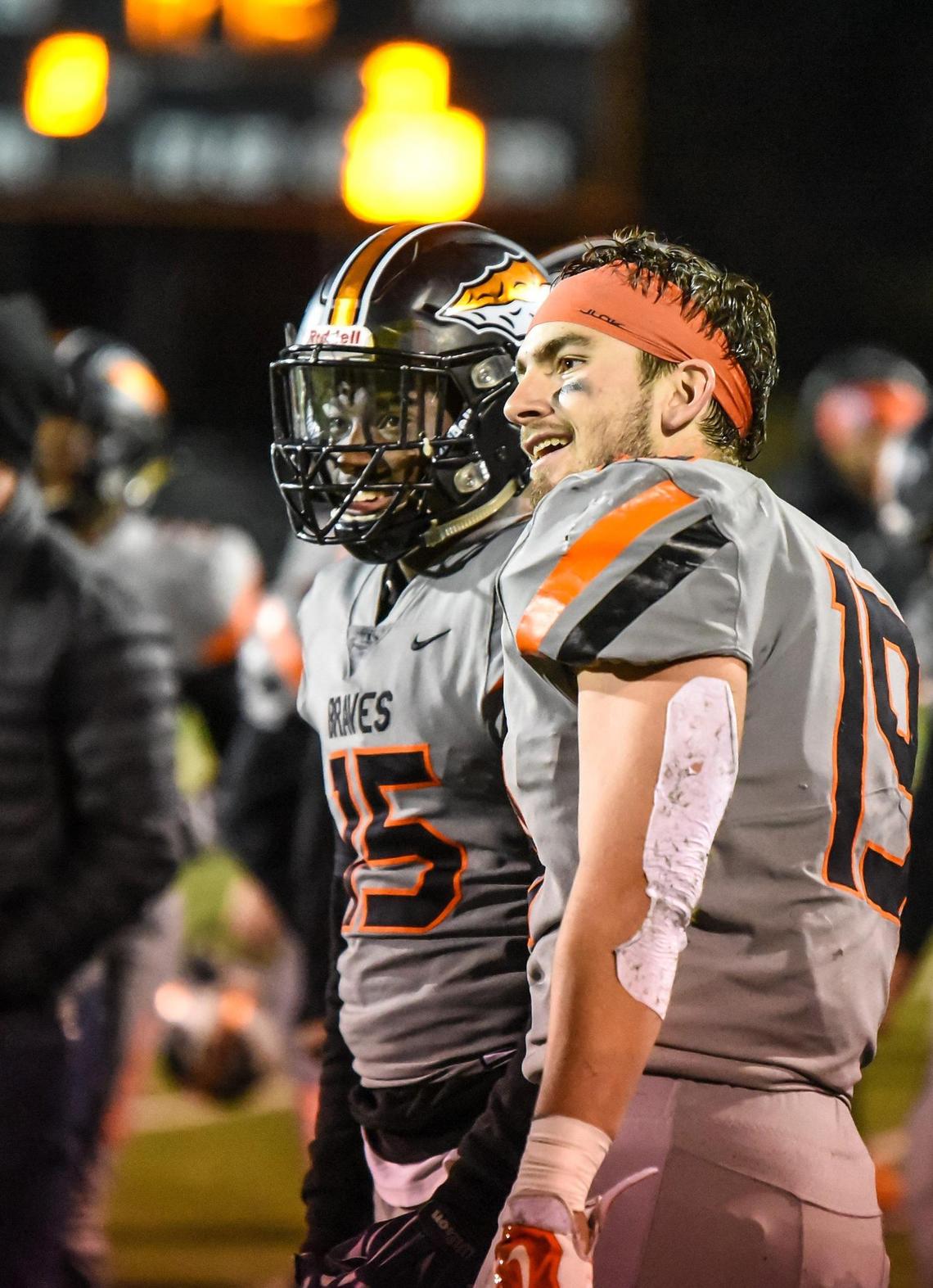 Before transferring to Olathe East High School, Jaylon Elmore, left, was a student in Bonner Springs, where he played football. At a 2019 game, as the fourth quarter ticked down, Elmore, left, and Bryce Krone looked on from the sideline.