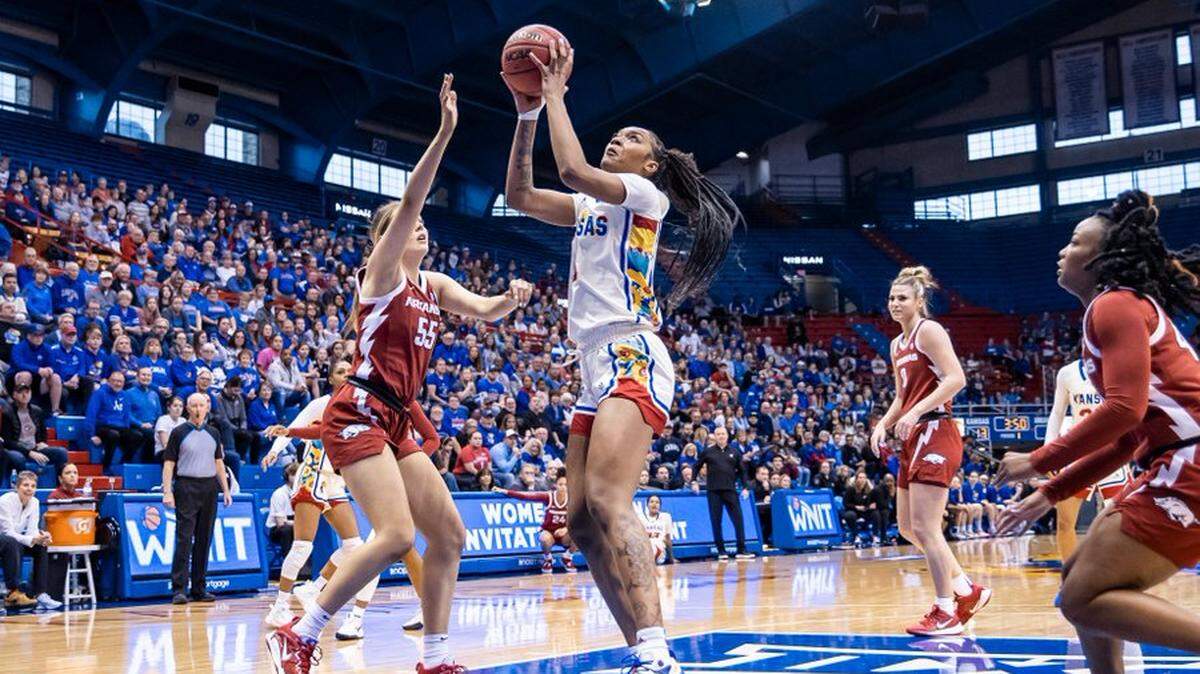Senior KU center Taiyanna Jackson scored 22 points with 10 rebounds and four blocked shots as the Jayhawks beat Arkansas in the WNIT Great 8 on Sunday.