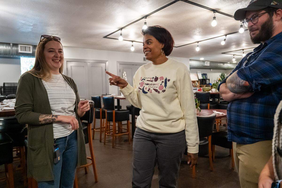 Chef Shanita McAfee-Bryant speaks to visitors at The Prospect KC, a community kitchen, on Thursday, November 6, 2025, in Kansas City. Homeless customers are able to come and eat a hot meal complete with service and a free pantry.