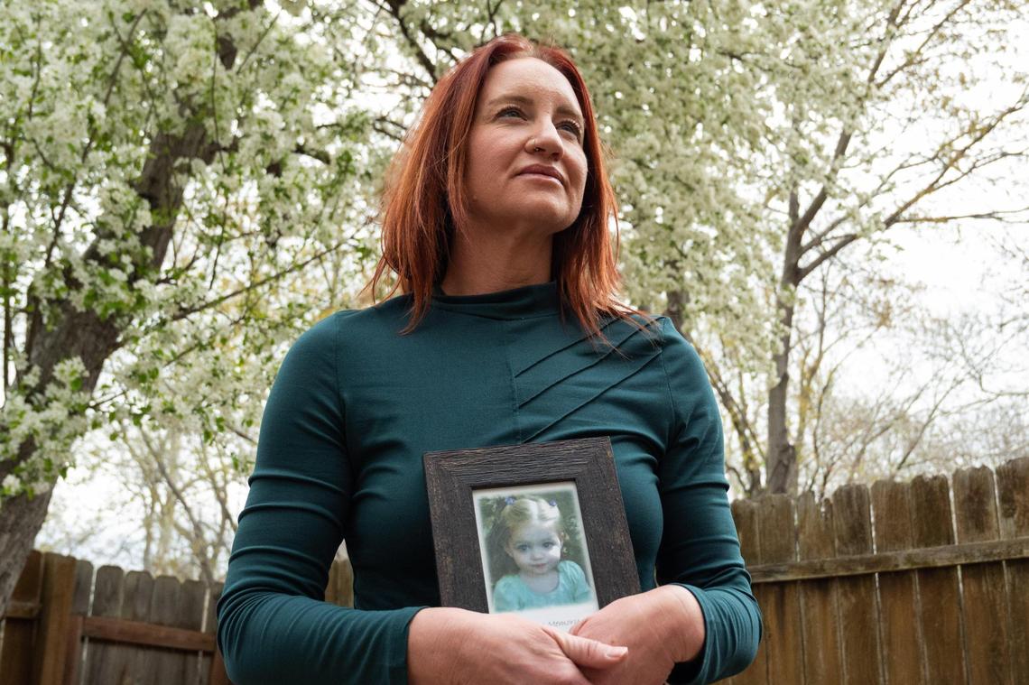 Alecia Patrick holds a photograph of her deceased daughter, Ava Olivia Patrick, on Tuesday, April 1, 2025 in Overland Park. The loss of Patrick’s daughter at an in-home daycare led her to advocate for the passing of Lexie’s Law in 2012, a Kansas law that strengthened childcare regulations.