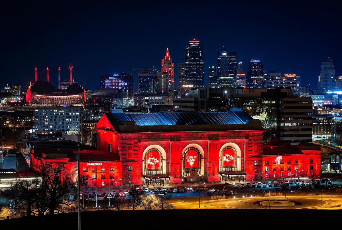 Union Station glows red against the backdrop of the Kansas City skyline in celebration of the Kansas City Chiefs trip to Super Bowl LV.