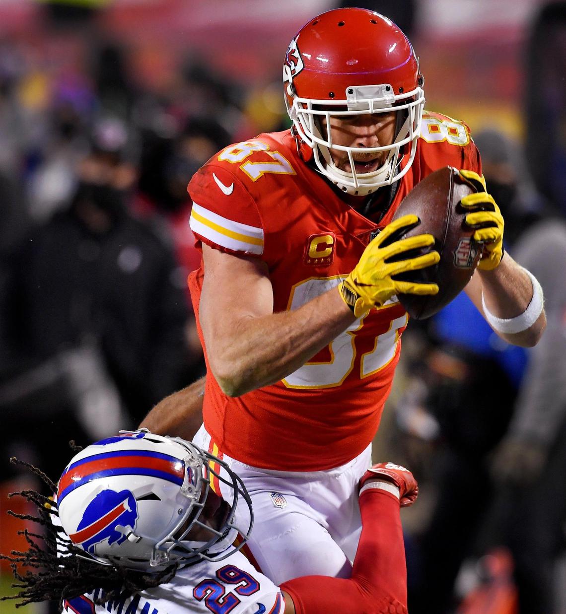Chiefs tight end Travis dives for the endzone over Buffalo’s Josh Norman during the first half of the AFC Championship Game Sunday at Arrowhead Stadium. Kansas City beat Buffalo, 38-24.