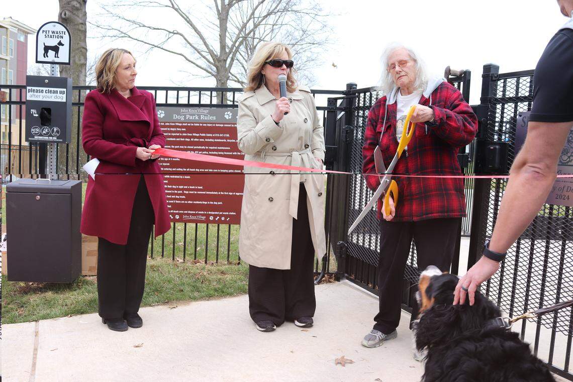 John Knox village residents and staff celebrate the opening of the dog park April 1, including Maria Timberlake, vice president of senior living at John Knox Village; Gail Benne, president of the John Knox Village Foundation; and Anna Slawsky, John Knox Village resident.