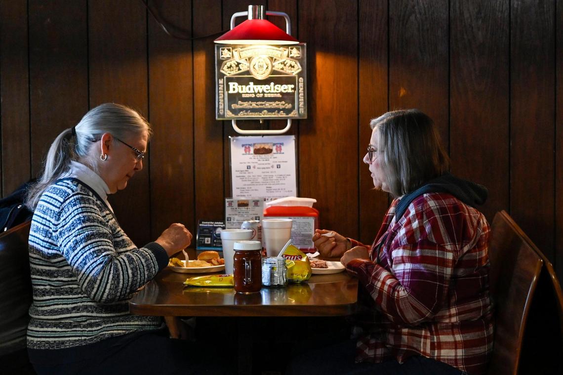 Sisters Ginny Weygint, left, of Lawrence and Carol Mitchell of Emporia meet for lunch at Guy and Mae’s Tavern. 