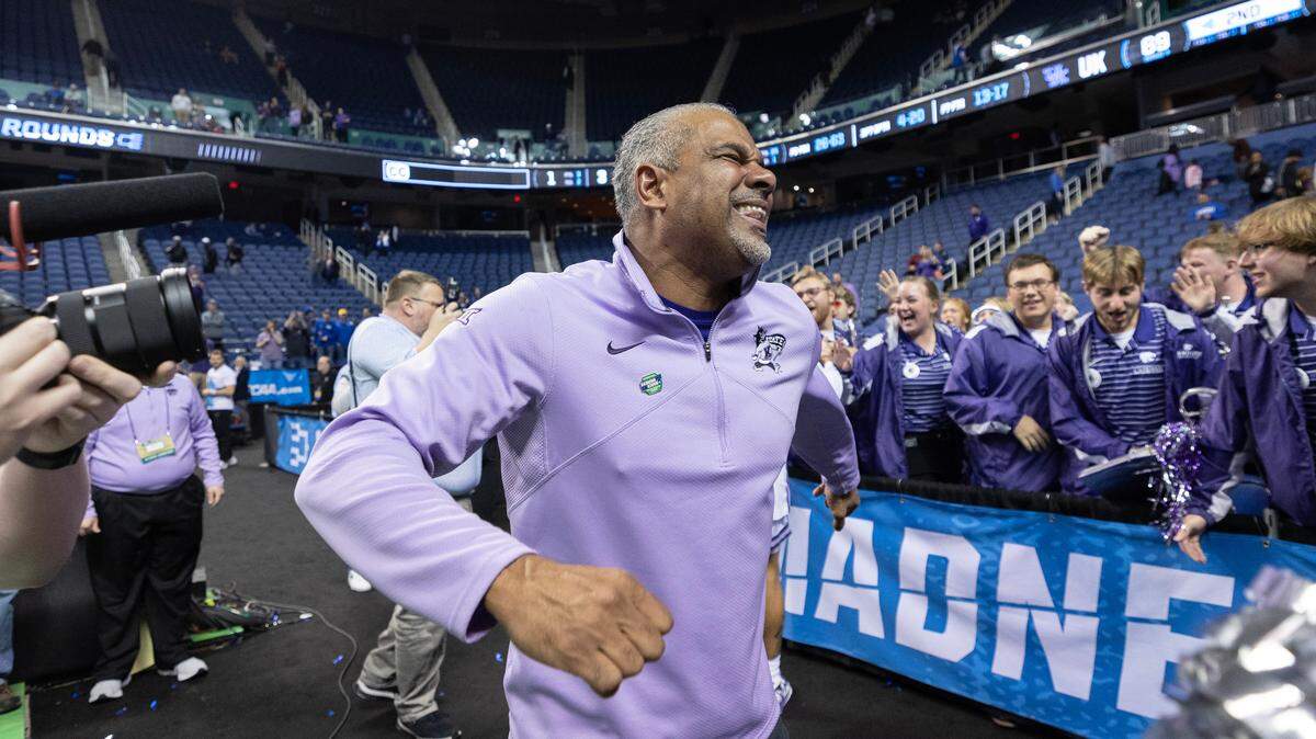 Kansas State coach Jerome Tang celebrates with the team’s cheerleaders after his team secured a spot in the Sweet 16 with a win over Kentucky in Greensboro, NC on Sunday.