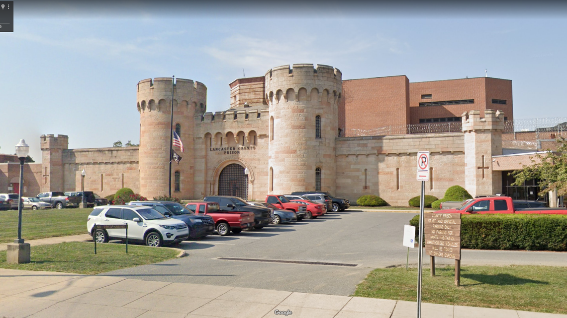Pennsylvania police accused the woman of open lewdness after they found her on top of her car with her kids outside the Lancaster County Prison.