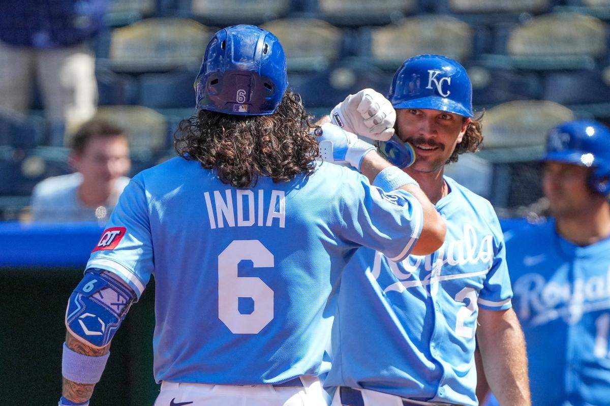 Kansas City Royals second baseman Jonathan India (6) celebrates with left fielder Adam Frazier (26) against the Chicago White Sox after hitting a two run home run to tie the game in the seventh inning at Kauffman Stadium on Aug 17, 2025 in Kansas City, Missouri, USA