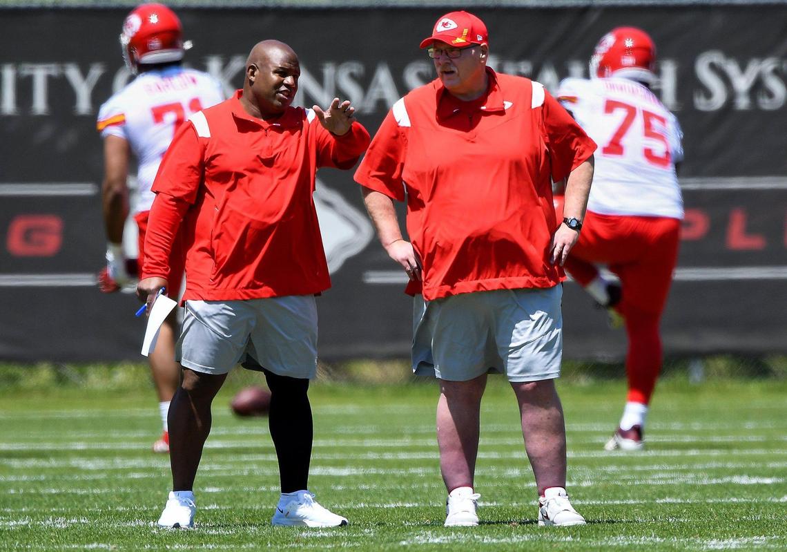 Offensive coordinator Eric Bieniemy and head coach Andy Reid observe players on the first day of Kansas City Chiefs rookie minicamp at the team’s training facility on Saturday, May 7, 2022.