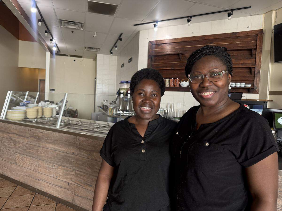 Florence Muni (left) and Abertha Reeves (right) pose inside their new restaurant.