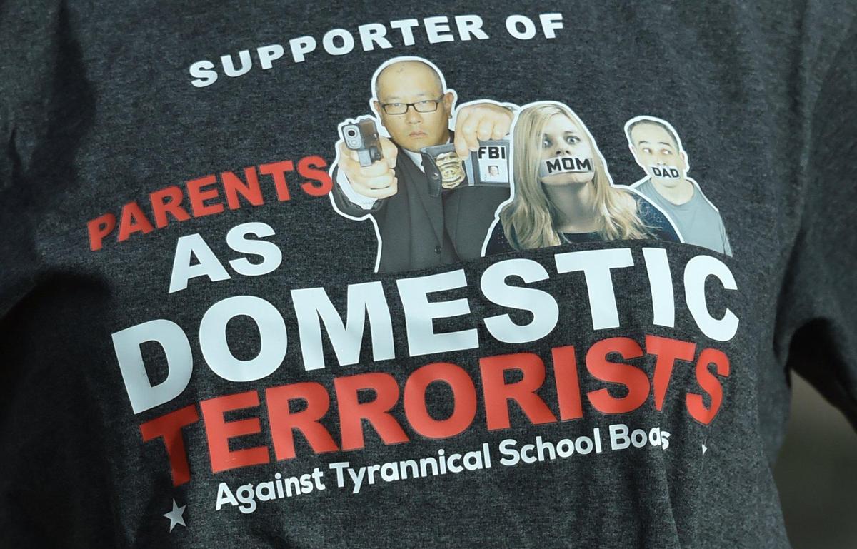 Christine Kraft, a mother of two daughters, is a member of the Northland Parent Association. She proudly wears a T-shirt that reads, “Supporter of Parents as Domestic Terrorists, Against Tyrannical School Boards.”