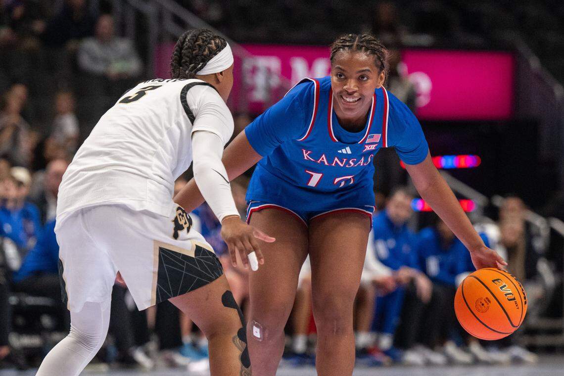 Kansas Jayhawks guard S'mya Nichols (12) smiles before running a play in the first half of the Jayhawks first round game of the Big 12 Women's Basketball Tournament on Thursday, March 5, 2026, at T-Mobile Center.