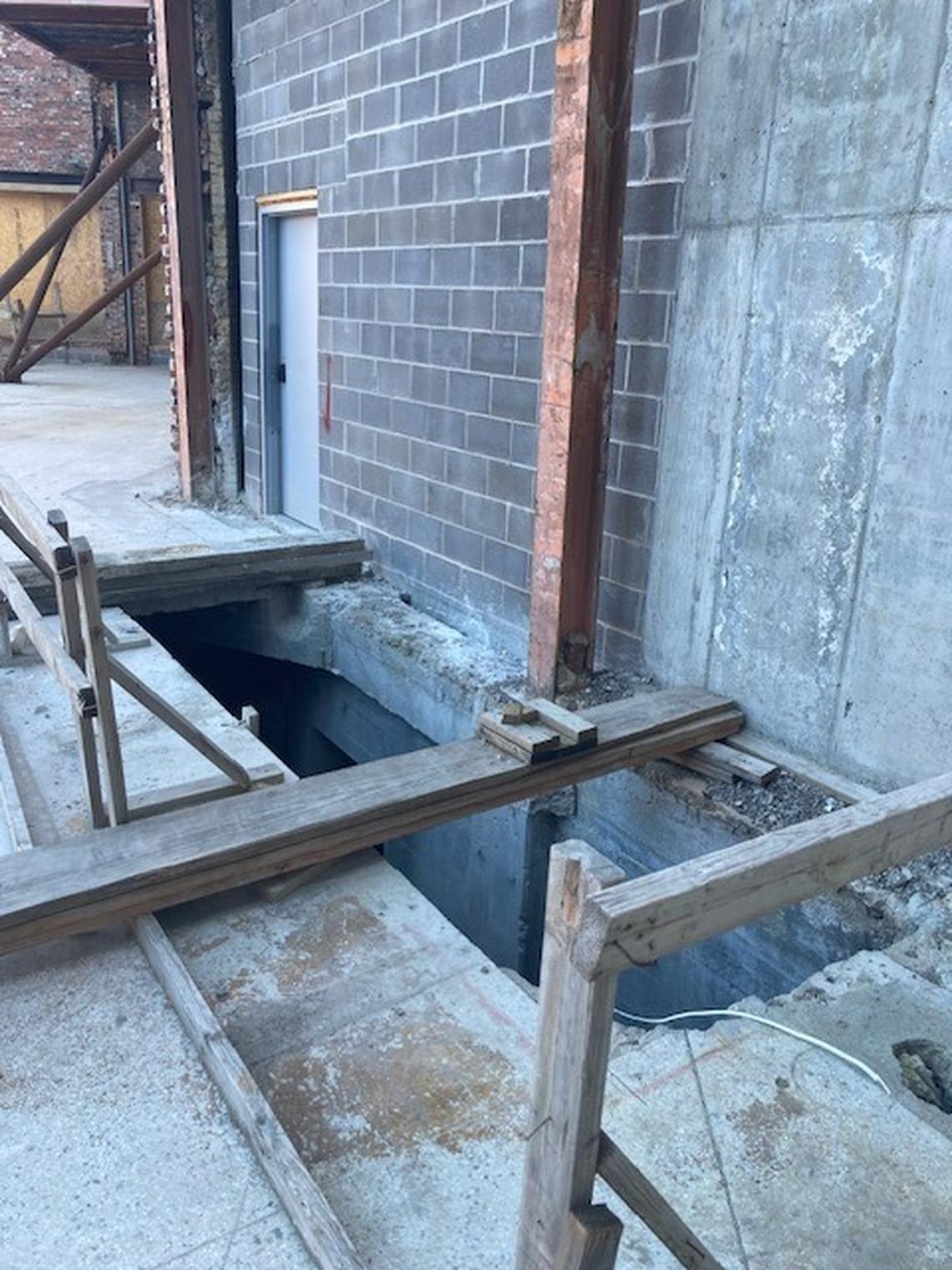 The unsecured worksite at Katz on Main, the luxury apartment apartment complex under construction at Westport Road and Main Street, shows an incomplete barrier around an open hole to the basement.