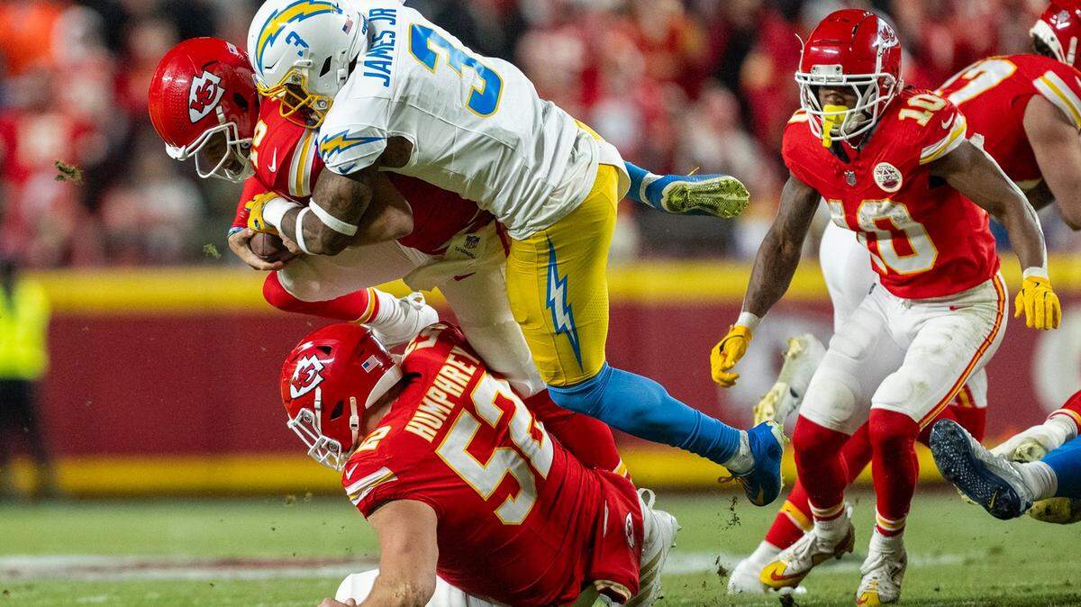 Kansas City Chiefs quarterback Patrick Mahomes (15) is sacked by Los Angeles Chargers safety Derwin James Jr. (3) Jr. in the first half on Sunday, Dec. 8, 2024, at GEHA Field at Arrowhead Stadium.