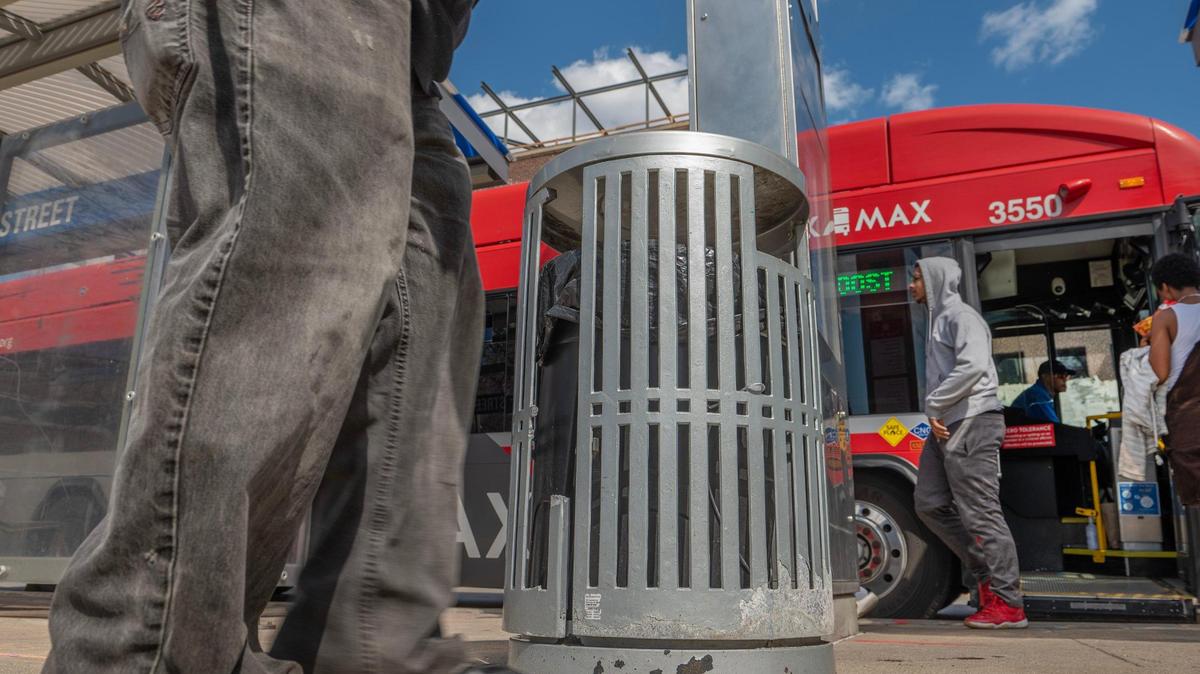 A Kansas City Area Transportation Authority garbage bin is seen on the corner of 31st Street and Troost Avenue on Tuesday, April 11, 2023, in Kansas City. Ruby Jean’s Juicery is one of the first businesses to adopt a bus stop garbage bin in a new KCATA program.
