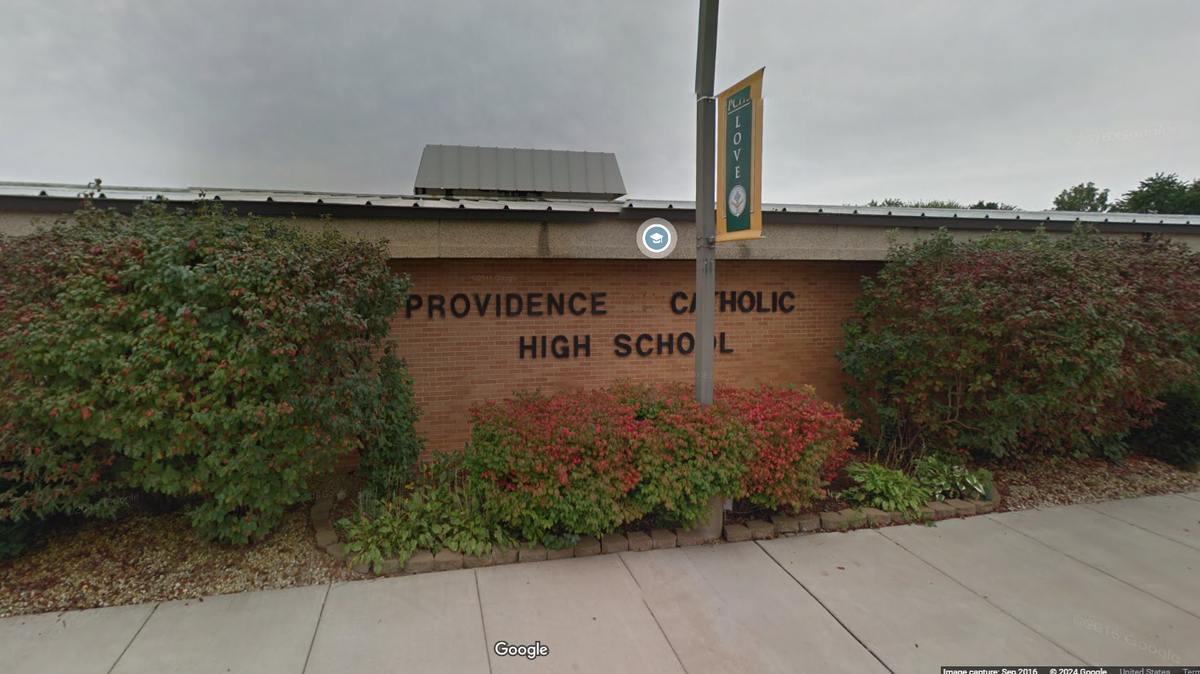 A father and son are suing a Catholic high school in Illinois.