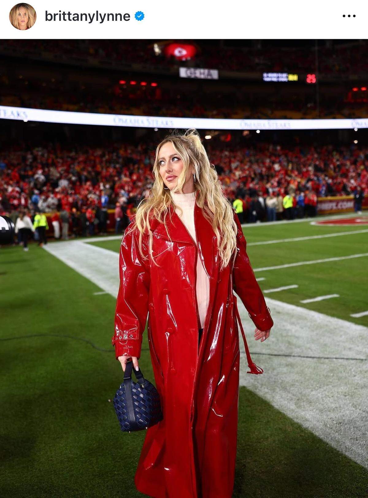 Brittany Mahomes wore a stunning red patent leather coat by Dolce & Gabbana to the “Sunday Night Football” game.