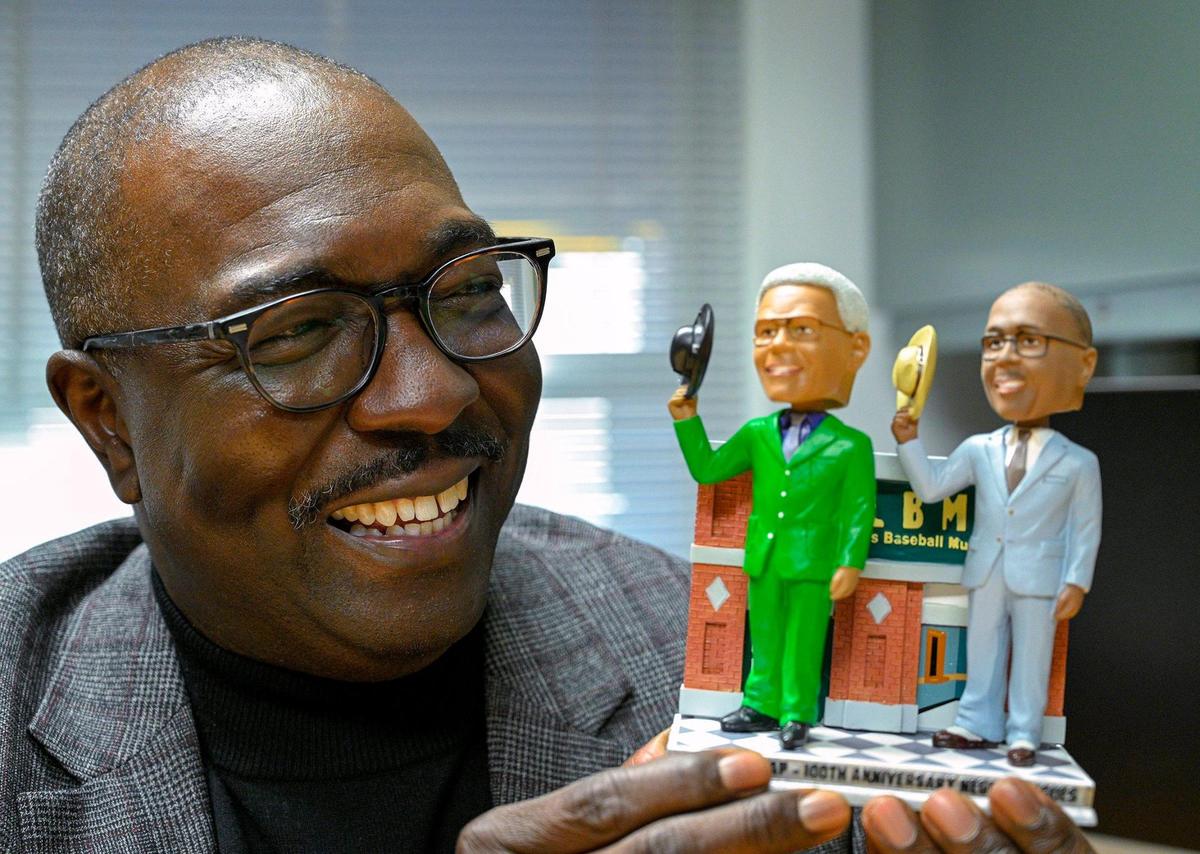 Bob Kendrick, president of the Negro Leagues Baseball Museum, has a double bobblehead of Buck O’Neil and himself. Kendrick says he often can feel O’Neil looking over his shoulder.